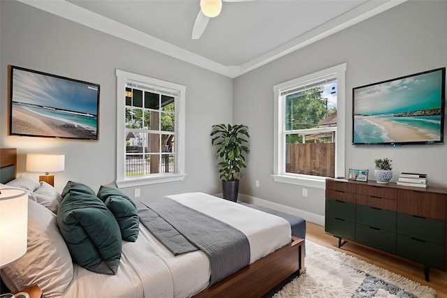 7024 Avenue Ave E, Houston, TX 77011 - bedroom featuring multiple windows, light wood finished floors, and baseboards