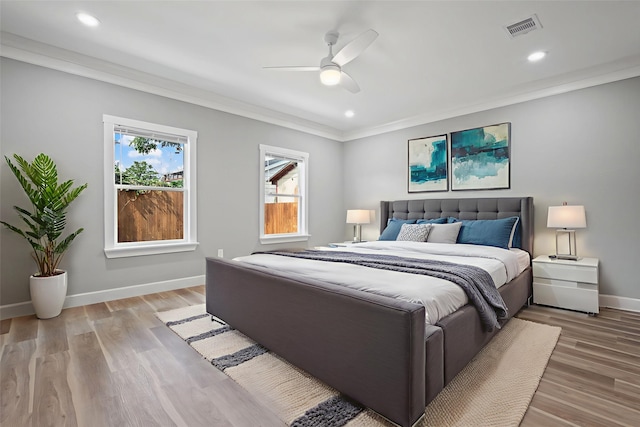 7024 Avenue Ave E, Houston, TX 77011 - bedroom with ornamental molding, baseboards, recessed lighting, light wood-type flooring, and a ceiling fan