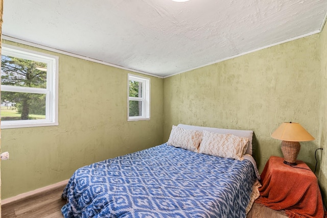 9 Wood Forest Dr, New Waverly, TX 77358 - bedroom featuring wood finished floors and baseboards
