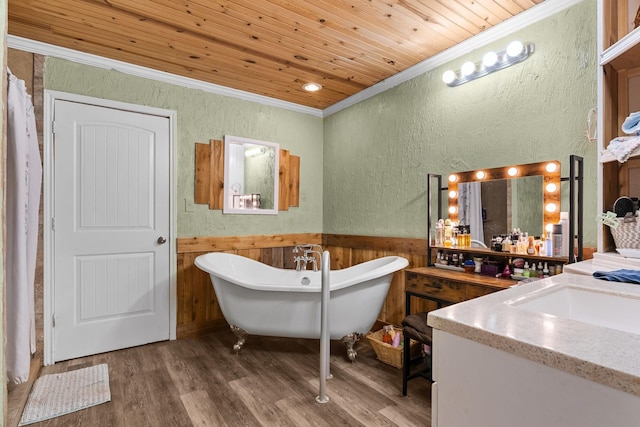 9 Wood Forest Dr, New Waverly, TX 77358 - bathroom featuring crown molding, a textured wall, vanity, wainscoting, and wood finished floors