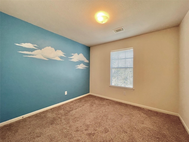 21807 Olympia Springs Ln, Katy, TX 77449 - carpeted empty room featuring baseboards and a textured ceiling