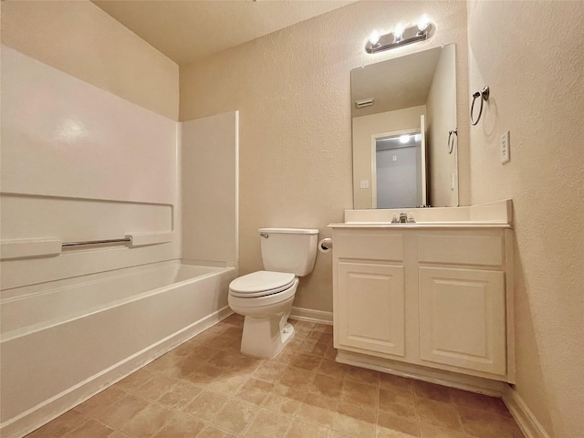 21807 Olympia Springs Ln, Katy, TX 77449 - full bath with vanity, toilet, shower / washtub combination, a textured wall, and baseboards