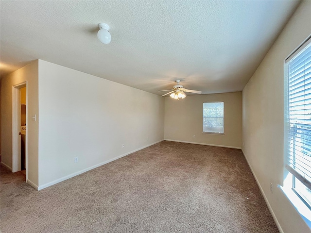 21807 Olympia Springs Ln, Katy, TX 77449 - carpeted empty room with ceiling fan, a textured ceiling, and baseboards