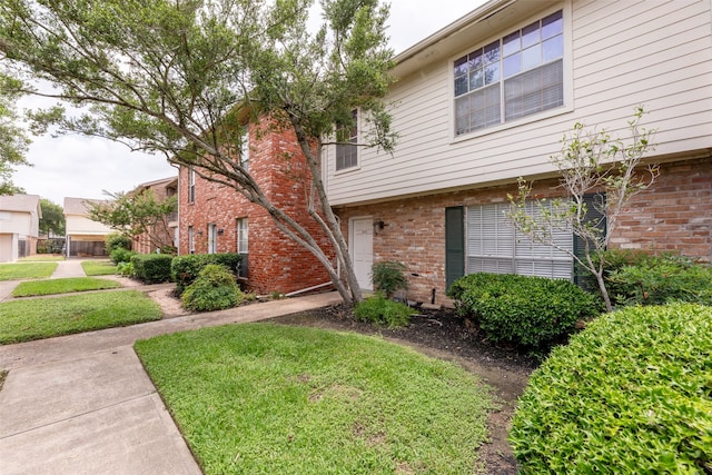 14721 Perthshire Rd, Houston, TX 77079 - view of front of property featuring brick siding and a front lawn