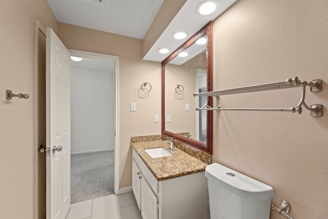 14721 Perthshire Rd, Houston, TX 77079 - bathroom with vanity, toilet, and tile patterned flooring