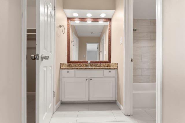 14721 Perthshire Rd, Houston, TX 77079 - full bathroom with vanity, tile patterned floors, baseboards, and tub / shower combination