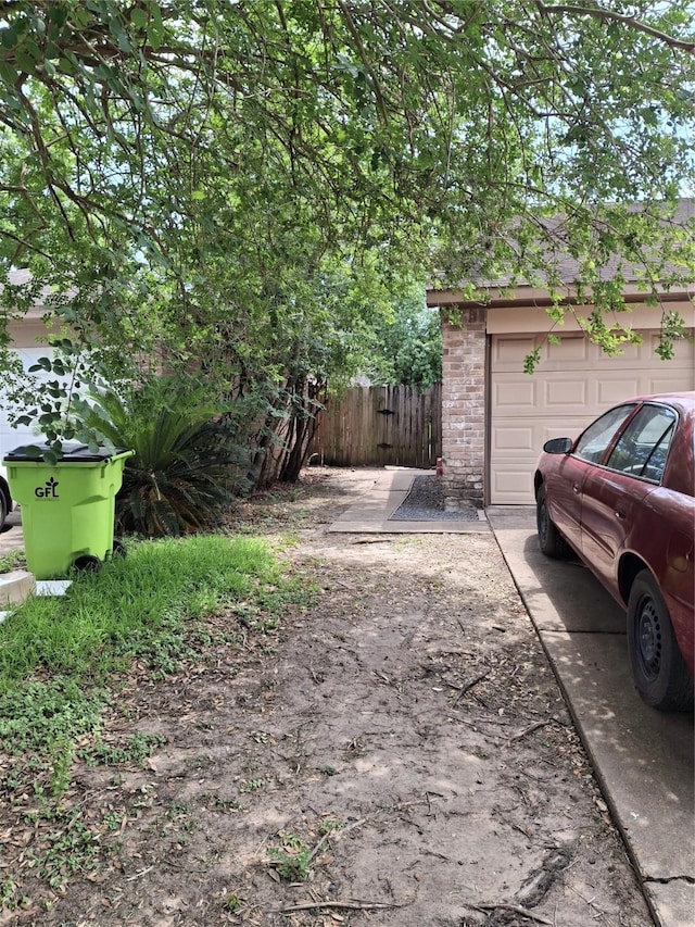 1115 Whispering Pine Dr, Missouri City, TX 77489 - garage with driveway