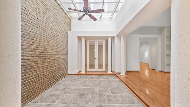 4868 Post Oak Timber Dr, Houston, TX 77056 - entryway with a ceiling fan, a towering ceiling, and french doors