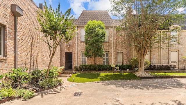 4868 Post Oak Timber Dr, Houston, TX 77056 - view of front of house with brick siding and a shingled roof