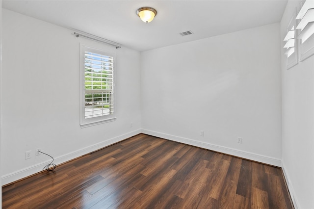 211 Twilight Toast Dr, Conroe, TX 77304 - empty room with dark wood-style flooring and baseboards