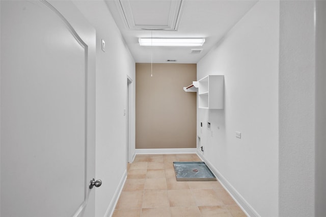 211 Twilight Toast Dr, Conroe, TX 77304 - laundry area with attic access, light tile patterned floors, and baseboards