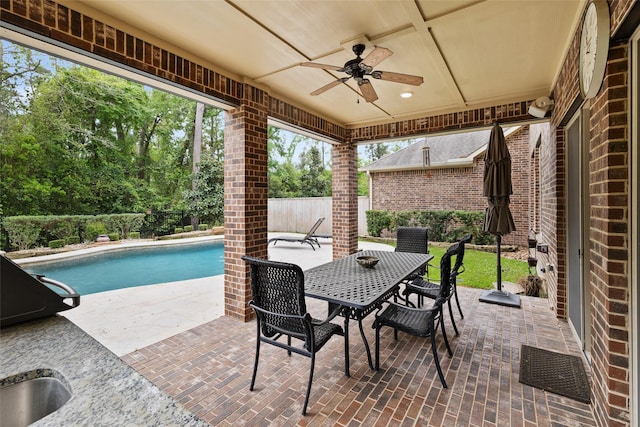 211 Twilight Toast Dr, Conroe, TX 77304 - fenced backyard with ceiling fan, a patio area, and outdoor dining space