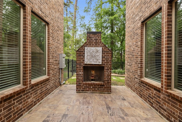 211 Twilight Toast Dr, Conroe, TX 77304 - view of patio with an outdoor brick fireplace