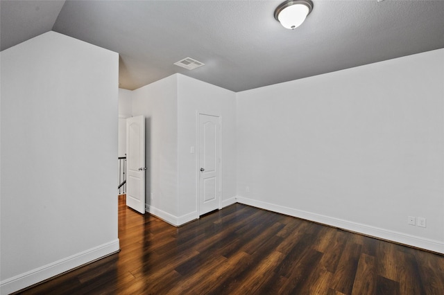 211 Twilight Toast Dr, Conroe, TX 77304 - additional living space featuring wood finished floors, baseboards, and vaulted ceiling