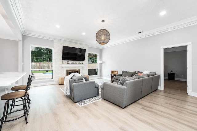 17706 August Meadows Ln, Spring, TX 77379 - living area featuring ornamental molding, plenty of natural light, light wood-type flooring, baseboards, and recessed lighting