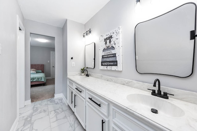 17706 August Meadows Ln, Spring, TX 77379 - full bath with marble finish floors, double vanity, baseboards, and ensuite bathroom