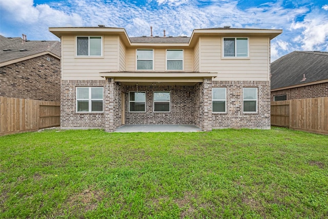 24511 Peroni Dr, Richmond, TX 77406 - rear view of property featuring brick siding and a patio