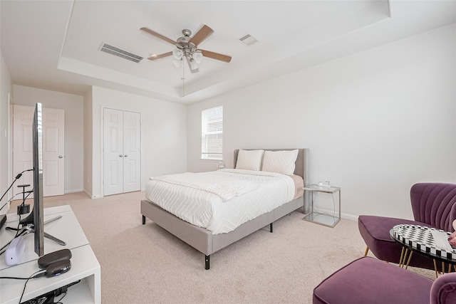 24511 Peroni Dr, Richmond, TX 77406 - bedroom with a raised ceiling, light carpet, baseboards, and a closet