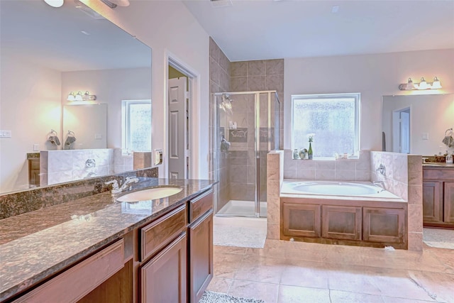 24511 Peroni Dr, Richmond, TX 77406 - bathroom featuring plenty of natural light, a stall shower, vanity, and a garden tub