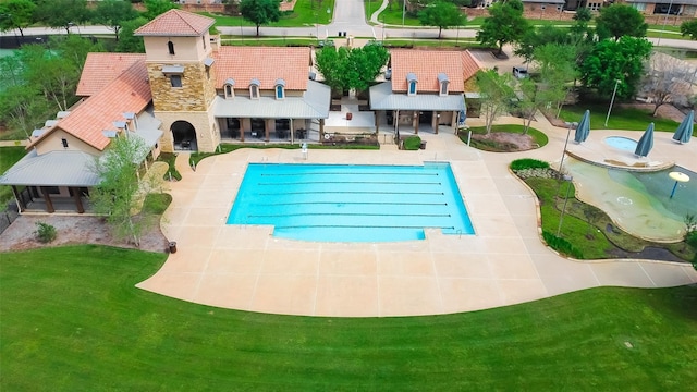 24511 Peroni Dr, Richmond, TX 77406 - community pool with a patio and a lawn