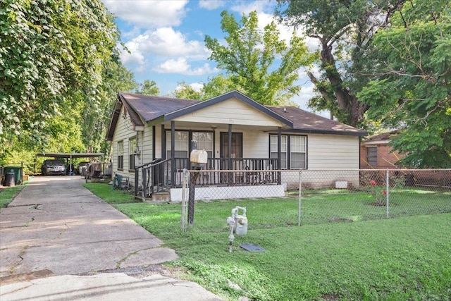 315 E Whitney St, Houston, TX 77022 - view of front of house with a porch, driveway, a detached carport, and a shingled roof