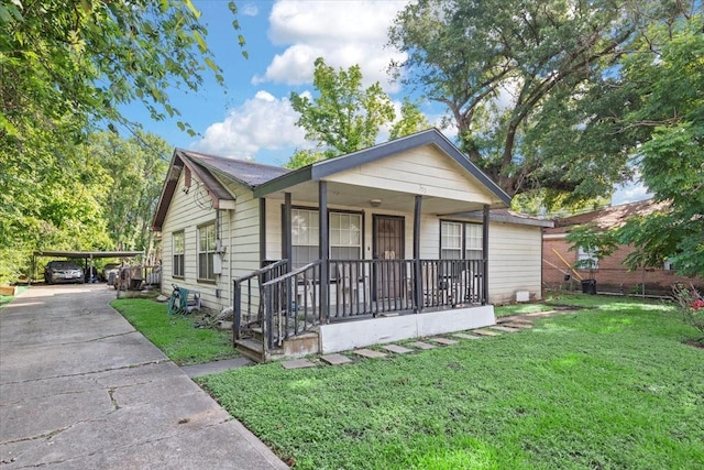 315 E Whitney St, Houston, TX 77022 - view of front of property featuring a porch, a front yard, and concrete driveway