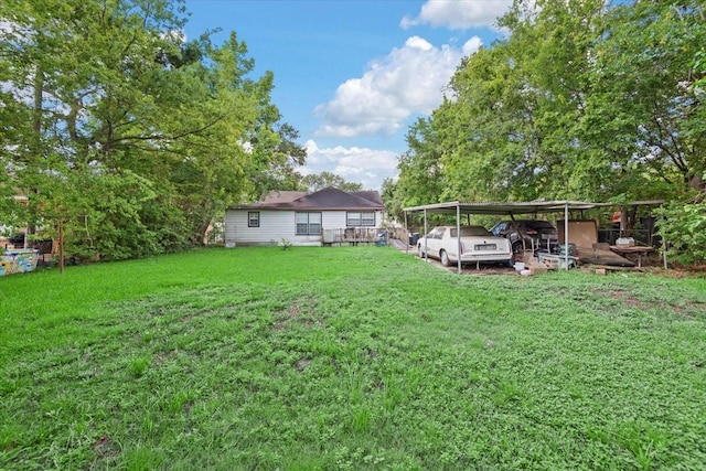 315 E Whitney St, Houston, TX 77022 - view of grassy yard with a detached carport