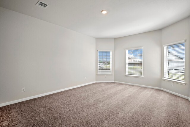 15695 Honey Cove Dr, Conroe, TX 77303 - carpeted empty room with baseboards