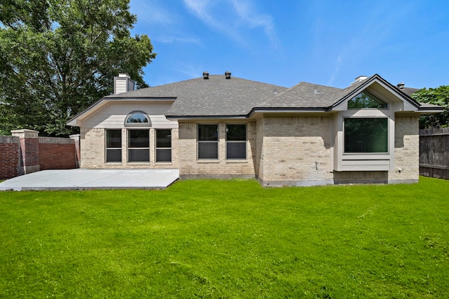 2619 Cedarmoor Ct, Houston, TX 77082 - back of property featuring a patio area, brick siding, roof with shingles, and a chimney