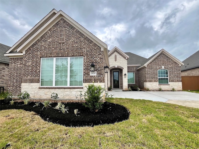 1806 Grass Valley Dr, Iowa Colony, TX 77583 - view of front of house with brick siding and a front yard