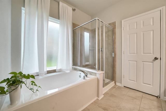 4502 Kayden Berry Ct, Rosenberg, TX 77471 - bathroom featuring a shower stall, a bath, and tile patterned flooring
