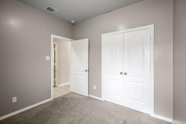 25807 Boxwood Hedge Ln, Tomball, TX 77375 - unfurnished bedroom featuring carpet floors, a closet, and baseboards