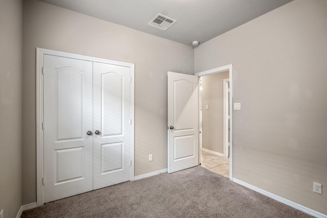 25807 Boxwood Hedge Ln, Tomball, TX 77375 - unfurnished bedroom with light carpet, a closet, and baseboards