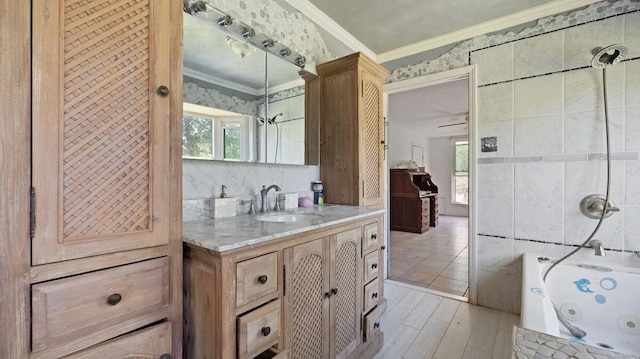 368 Riddle Rd, Cedar Creek, TX 78612 - full bath featuring vanity, ornamental molding, and wood finished floors