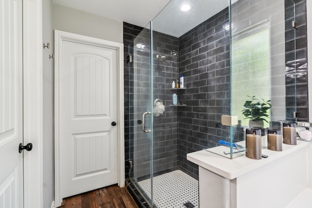 129 Bridgepoint, Onalaska, TX 77360 - full bath with a stall shower, wood finished floors, and vanity