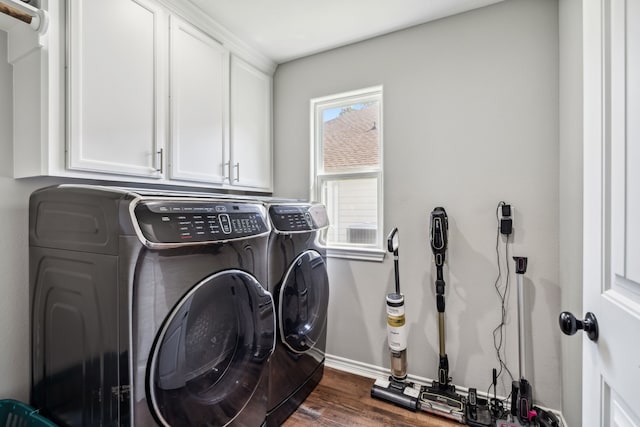 129 Bridgepoint, Onalaska, TX 77360 - laundry room featuring independent washer and dryer, cabinet space, dark wood-style flooring, and baseboards