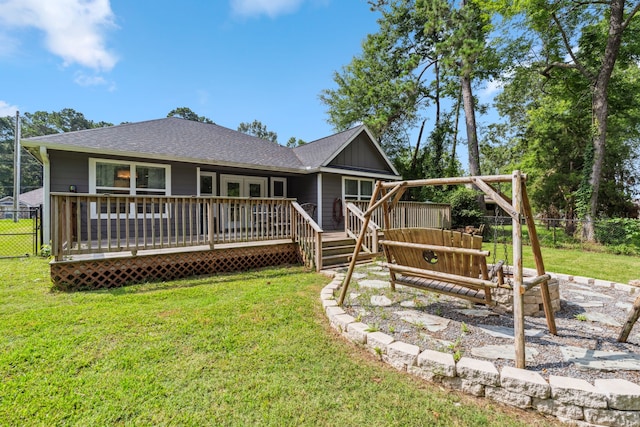 129 Bridgepoint, Onalaska, TX 77360 - back of property featuring a wooden deck, roof with shingles, and board and batten siding