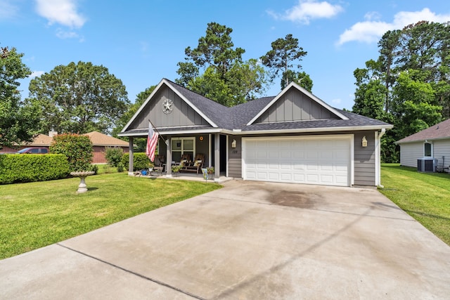 129 Bridgepoint, Onalaska, TX 77360 - single story home featuring board and batten siding, a front lawn, an attached garage, and central AC unit