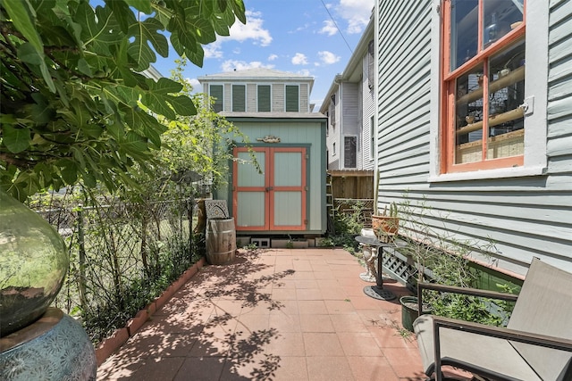 811 18th St, Galveston, TX 77550 - view of patio / terrace featuring a shed