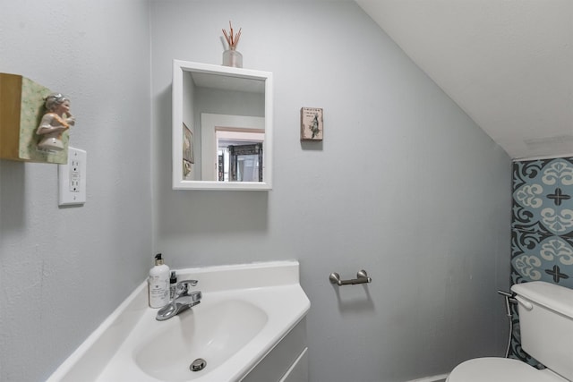 811 18th St, Galveston, TX 77550 - bathroom featuring vanity and vaulted ceiling