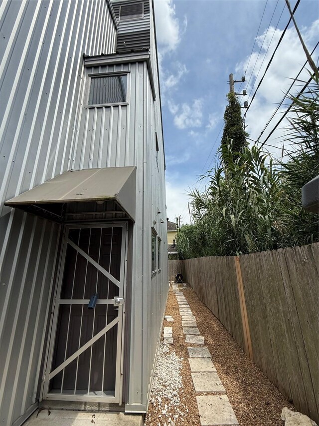 2508 Calumet St Unit E, Houston, TX 77004 - view of side of home featuring a fenced backyard and an outdoor structure