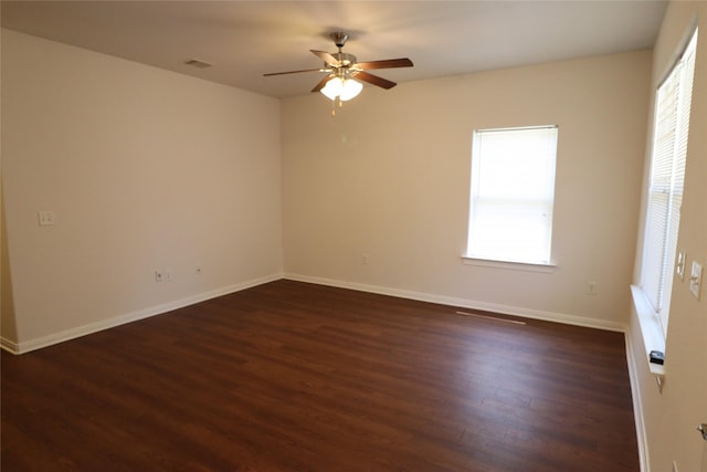 322 7th Ave N, Texas City, TX 77590 - empty room featuring dark wood-style floors, ceiling fan, and baseboards