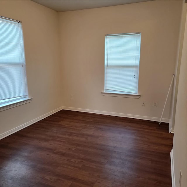 322 7th Ave N, Texas City, TX 77590 - empty room featuring dark wood-style floors and baseboards