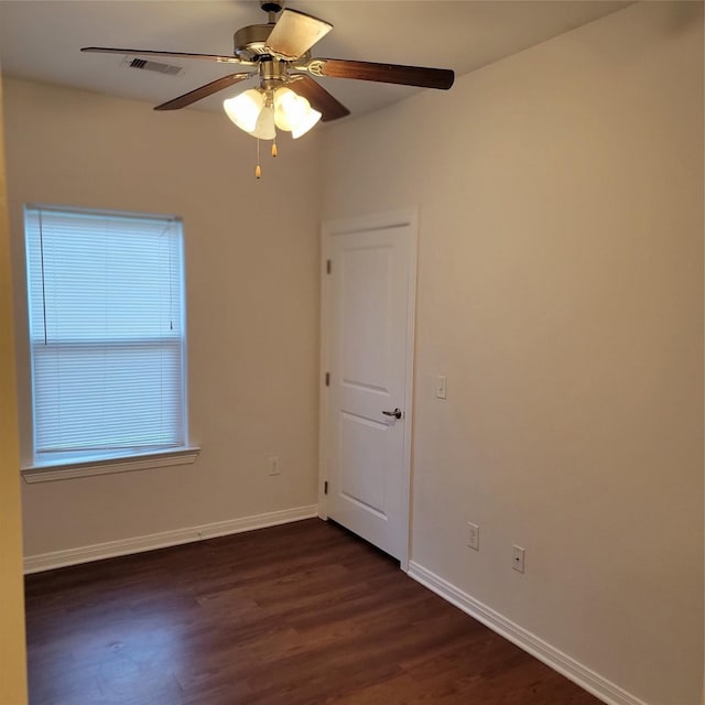 322 7th Ave N, Texas City, TX 77590 - empty room with dark wood finished floors, ceiling fan, and baseboards