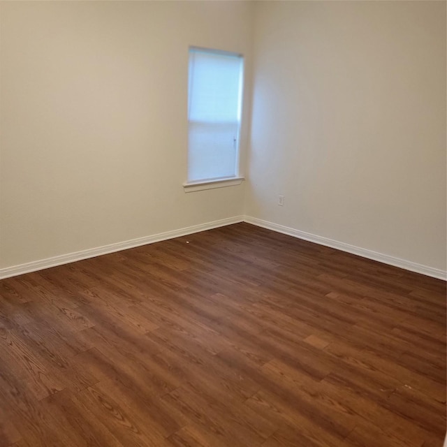 322 7th Ave N, Texas City, TX 77590 - unfurnished room with dark wood finished floors and baseboards