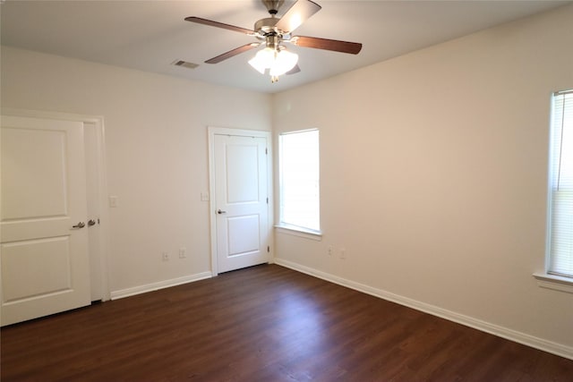 322 7th Ave N, Texas City, TX 77590 - empty room with dark wood finished floors, baseboards, and a ceiling fan