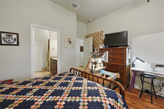 2209 Parker Ct, Brenham, TX 77833 - bedroom featuring wood finished floors and ensuite bathroom