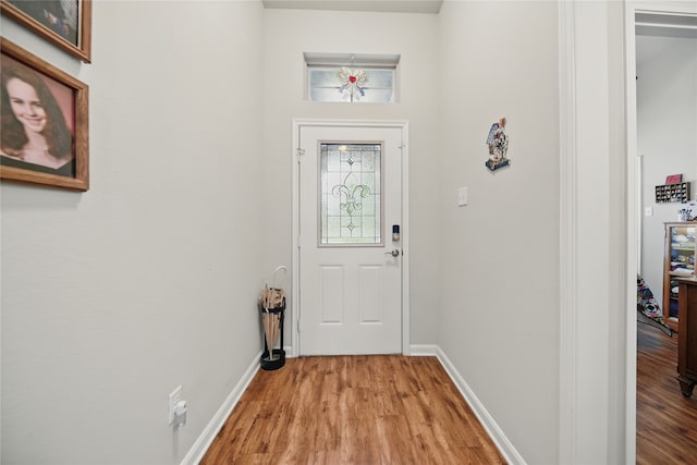 2209 Parker Ct, Brenham, TX 77833 - doorway to outside featuring light wood finished floors and baseboards