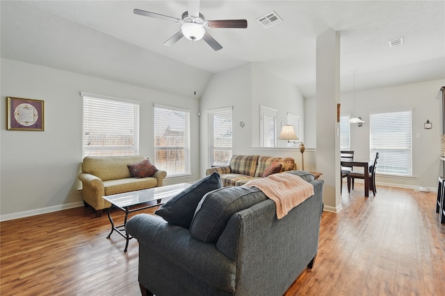 2209 Parker Ct, Brenham, TX 77833 - living area with ceiling fan, plenty of natural light, light wood-style floors, and vaulted ceiling