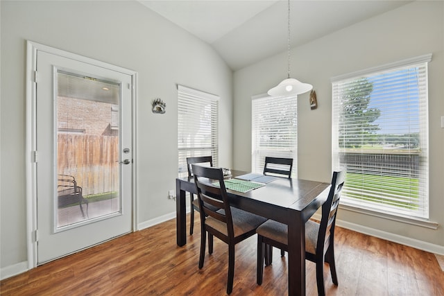 2209 Parker Ct, Brenham, TX 77833 - dining room with lofted ceiling, wood finished floors, and baseboards